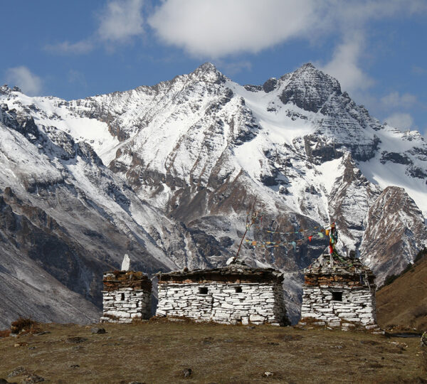 High-altitude stone chortens with snow-covered Himalayan peaks in Bhutan